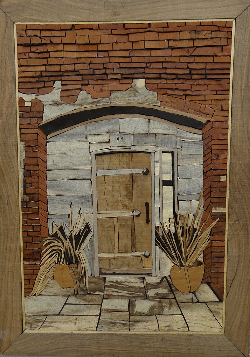 هنرمندی دانش آموز مجتمع آموزشی جاوید در هنر معرق چوب